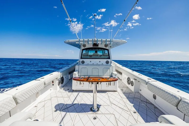Slide: The Image of 2023 HCB 53 Suenos boat on open ocean under clear blue sky. - 86