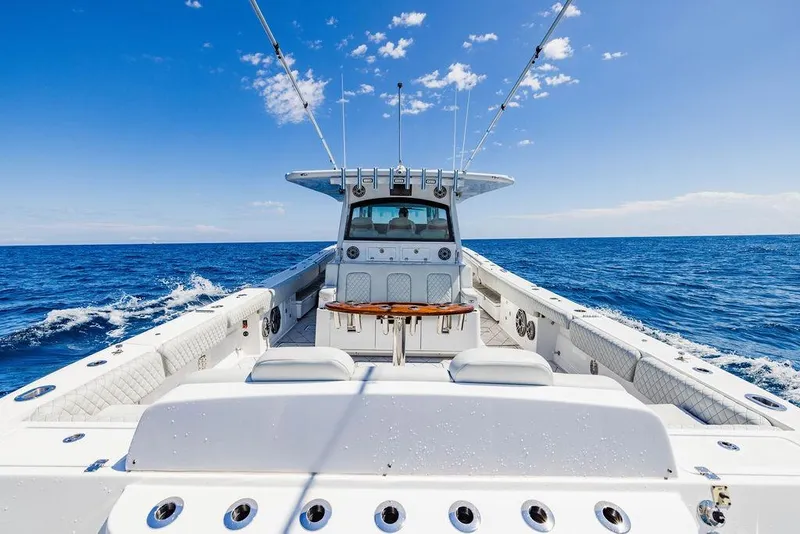 Slide: The Image of 2023 HCB 53 Suenos boat cruising on open ocean under clear blue sky. - 87
