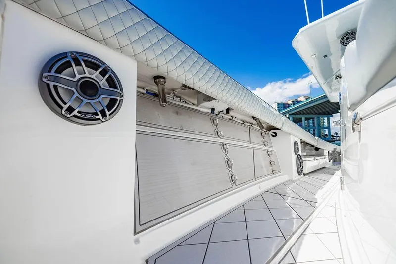 Slide: The Image of 2023 HCB 53 Suenos boat interior with speakers and storage compartments. - 99