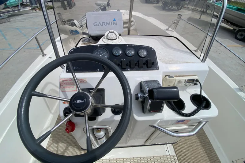 Slide: The Image of Steering console of a 2000 Boston Whaler Dauntless 18 with Garmin navigation. - 19