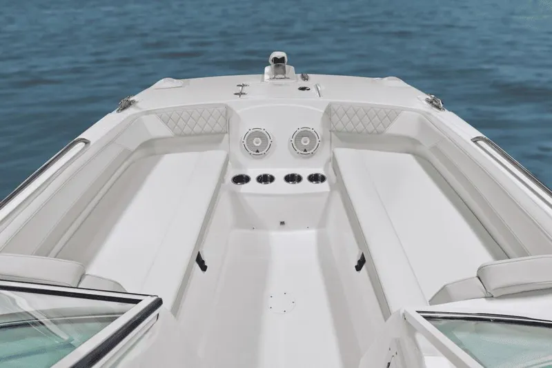 Slide: The Image of Manufacturer Provided Image: 2026 World Cat 230 DC boat interior with seating, speakers, and ocean backdrop. - 3