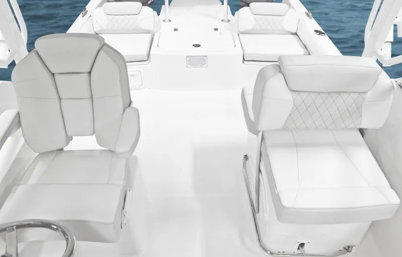 Slide: The Image of Manufacturer Provided Image: 2026 World Cat 230 DC boat interior with white seating and modern design. - 5