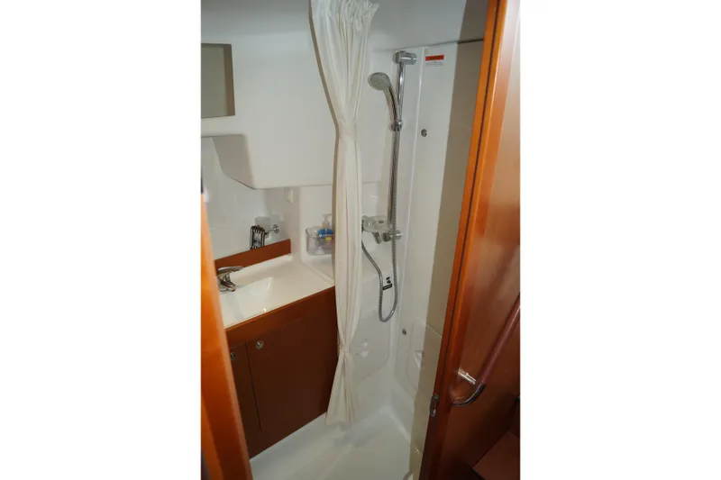 Slide: The Image of Bathroom of 2014 Beneteau Swift Trawler 34 with shower and sink. - 10