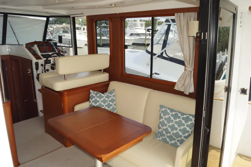 Slide: The Image of Interior of 2014 Beneteau Swift Trawler 34 with seating and helm station. - 15