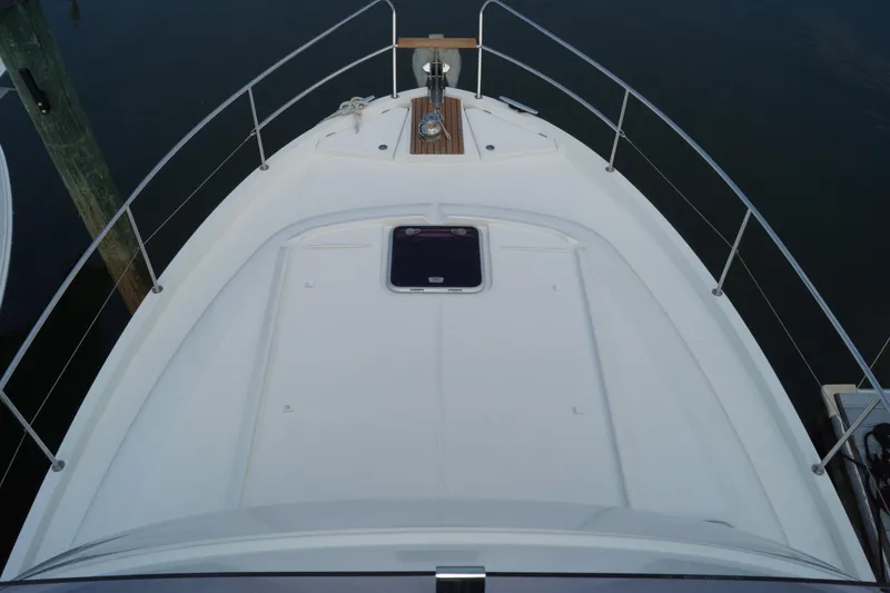 Slide: The Image of Bow view of 2014 Beneteau Swift Trawler 34, featuring sleek deck design and railing. - 29