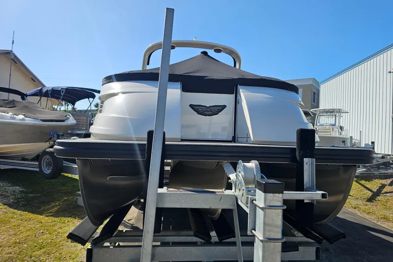 Slide: The Image of 2025 Bennington QX 27 QXSBWA X2 Swingback pontoon boat on trailer, rear view. - 10