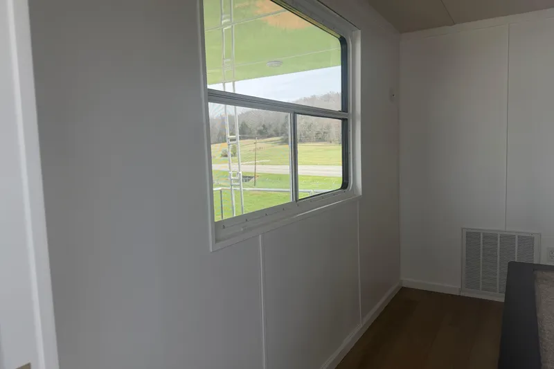 Slide: The Image of Interior view of 2026 Sumerset Voyager with window overlooking scenic landscape. - 10