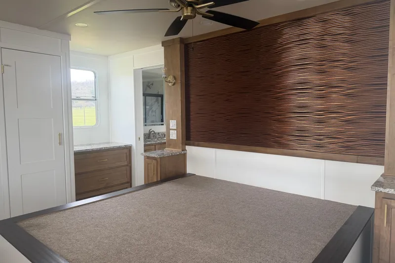 Slide: The Image of Luxurious 2026 Sumerset Voyager interior with modern design, featuring a stylish bedroom and elegant wood accents. - 16