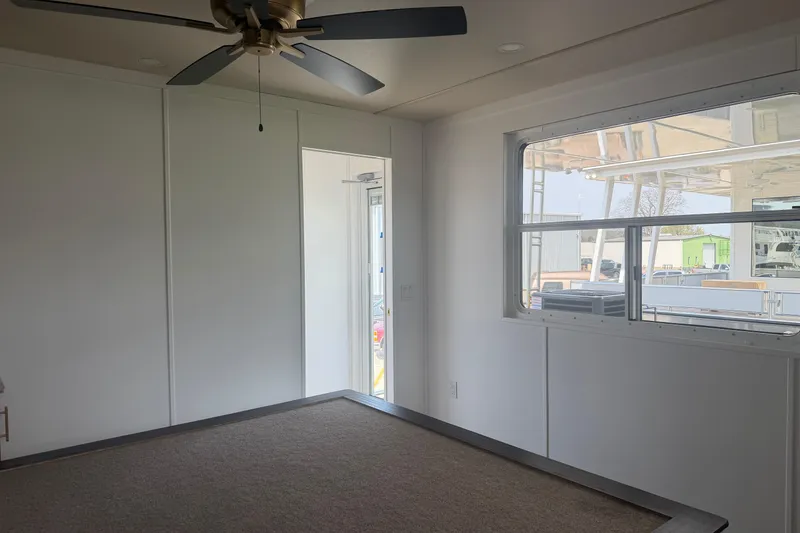 Slide: The Image of Interior of 2026 Sumerset Voyager with ceiling fan and large window. - 17