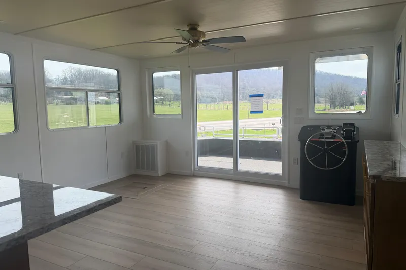 Slide: The Image of Interior of 2026 Sumerset Voyager houseboat with modern design and panoramic windows. - 5