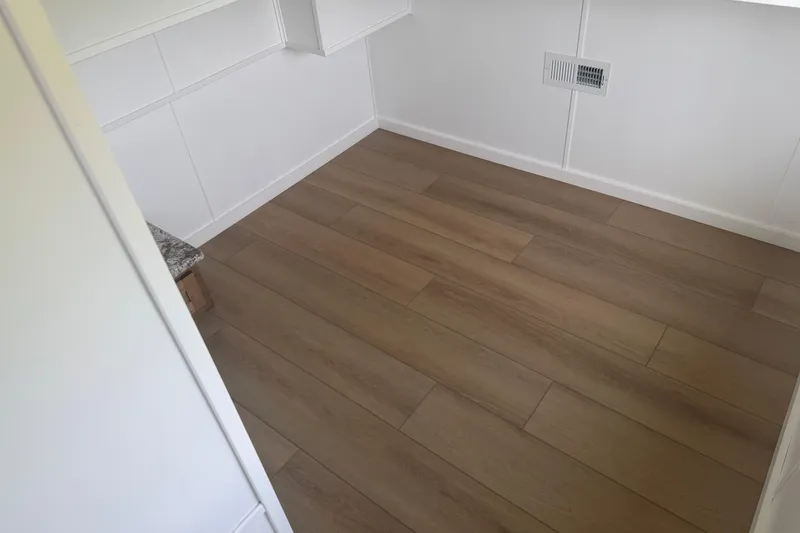 Slide: The Image of Modern interior of 2026 Sumerset Voyager with wood flooring and white walls. - 6