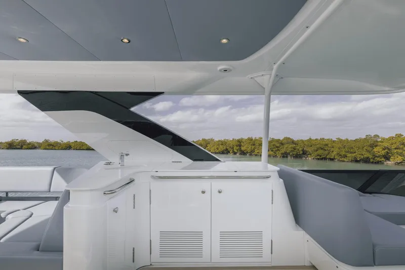Slide: The Image of 2025 Cruisers Yachts 57 Fly deck with sleek design and modern amenities. - 19