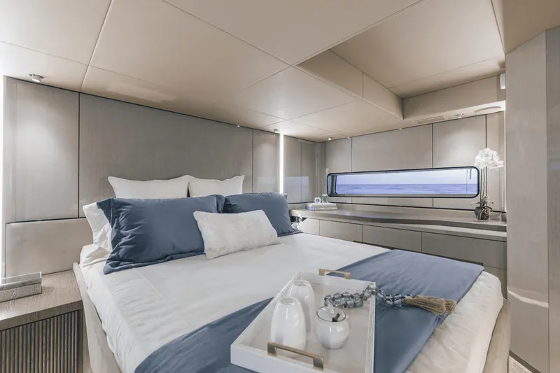 Slide: The Image of Luxurious bedroom interior of 2025 Cruisers Yachts 57 Fly, featuring elegant bedding and modern design. - 49