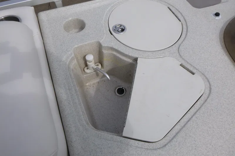 Slide: The Image of 2006 Harris FloteBote Crowne 250 boat sink and countertop detail. - 12