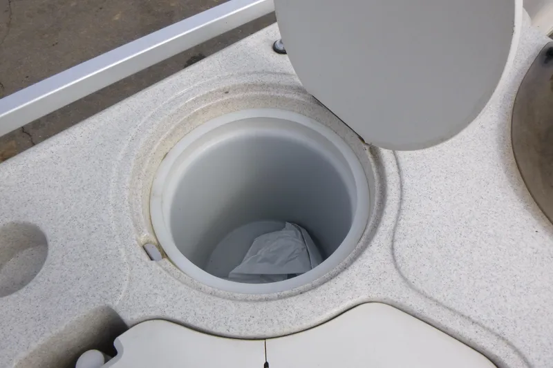 Slide: The Image of Open storage compartment on 2006 Harris FloteBote Crowne 250 boat. - 13