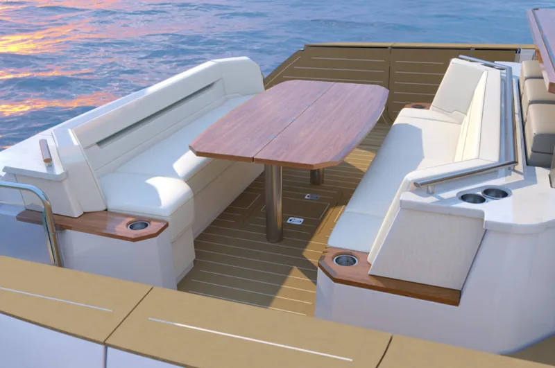 Slide: The Image of Luxury seating area on 2024 Tiara Yachts EX 60 with ocean view. - 16