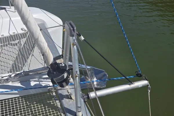 Slide: The Image of Bow of 2018 Lagoon 42 catamaran with rigging and netting over water. - 21