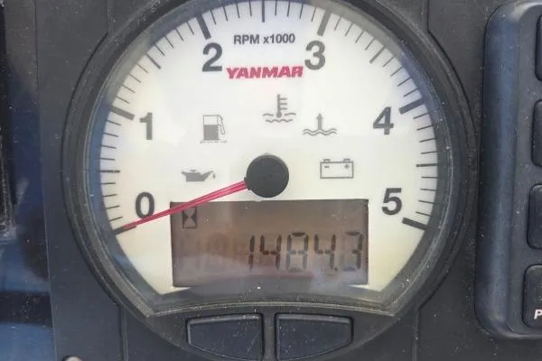 Slide: The Image of Yanmar RPM gauge displaying 1484.3 hours on a 2018 Lagoon 42. - 25