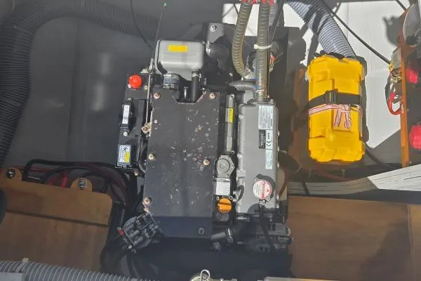 Slide: The Image of Engine compartment of a 2018 Lagoon 42 catamaran with visible components and wiring. - 28