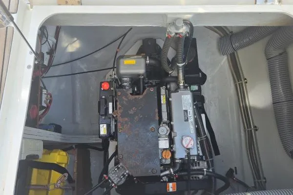 Slide: The Image of Engine compartment of a 2018 Lagoon 42 catamaran, showcasing mechanical components and wiring. - 29