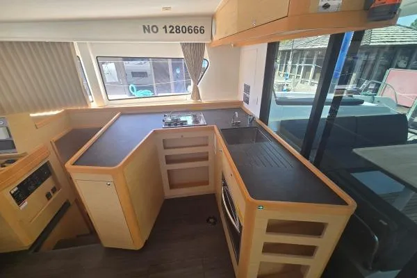 Slide: The Image of Interior view of a 2018 Lagoon 42 yacht kitchen with modern appliances and ample counter space. - 5
