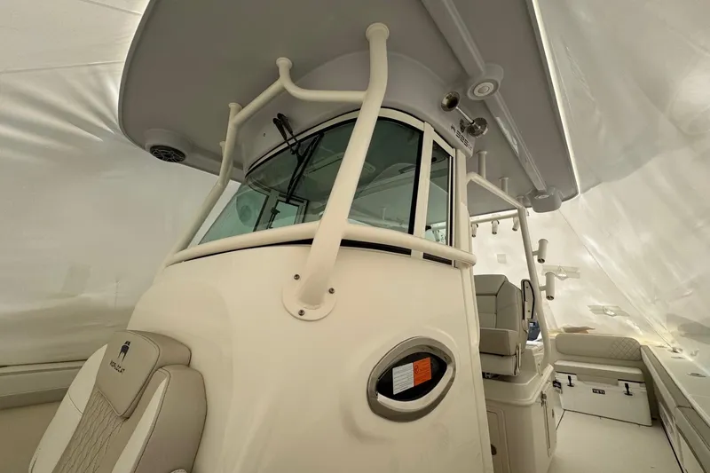 Slide: The Image of 2026 World Cat 325 CC boat interior with modern helm and seating. - 12