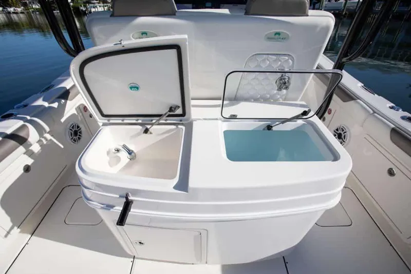 Slide: The Image of Manufacturer Provided Image: 2026 World Cat 325 CC boat interior with dual sinks and storage compartments. - 29