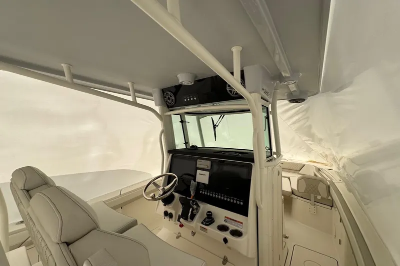 Slide: The Image of Interior view of 2026 World Cat 325 CC boat cockpit with modern controls. - 7