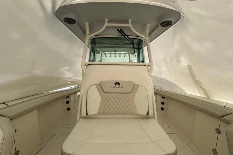 Slide: The Image of 2026 World Cat 325 CC boat interior with beige seating and modern design. - 8