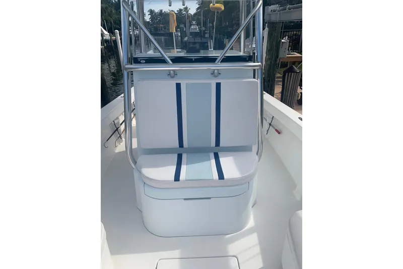 Slide: The Image of 2015 Stuart 26 boat deck with storage compartments and cleaning brush. - 11