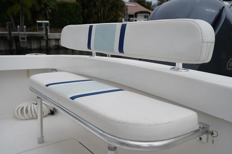 Slide: The Image of White and blue seating on a 2015 Stuart 26 boat, featuring sleek design and comfort. - 16
