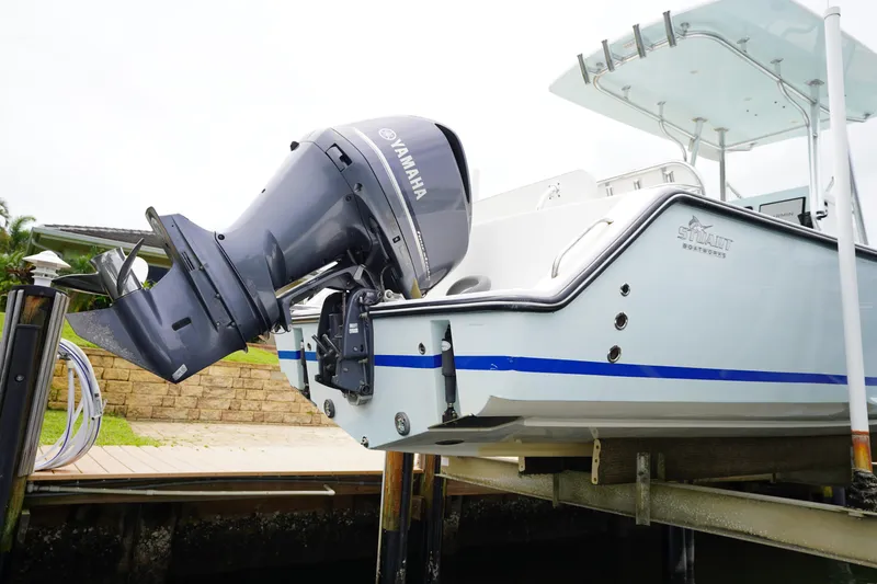 Slide: The Image of 2015 Stuart 26 boat with Yamaha outboard motor on a lift. - 25