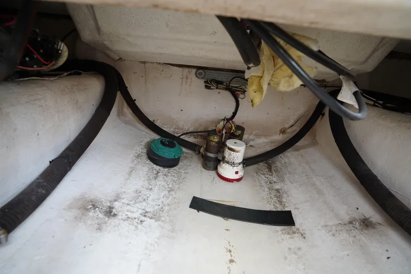 Slide: The Image of Bilge area of a 2015 Stuart 26 boat with wiring and components. - 31