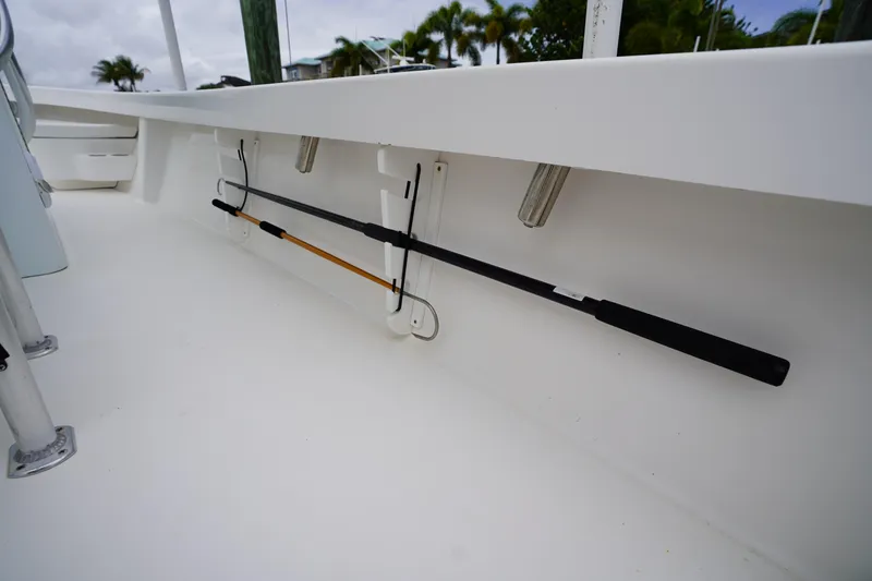 Slide: The Image of Interior view of a 2015 Stuart 26 boat showing fishing rod holders. - 35