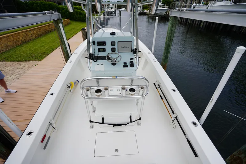 Slide: The Image of Stuart 26 boat interior with control panel, docked by the water, 2015 model. - 36