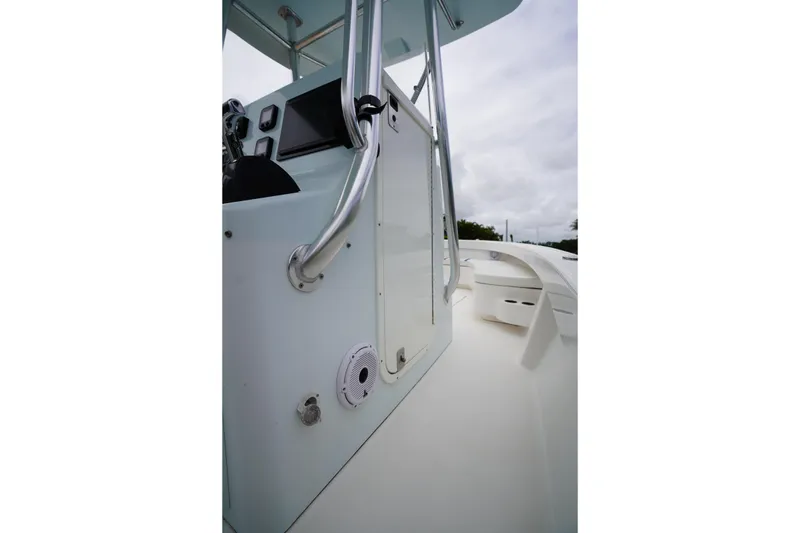 Slide: The Image of Stuart 26 boat interior, 2015 model, featuring control panel and seating area. - 45
