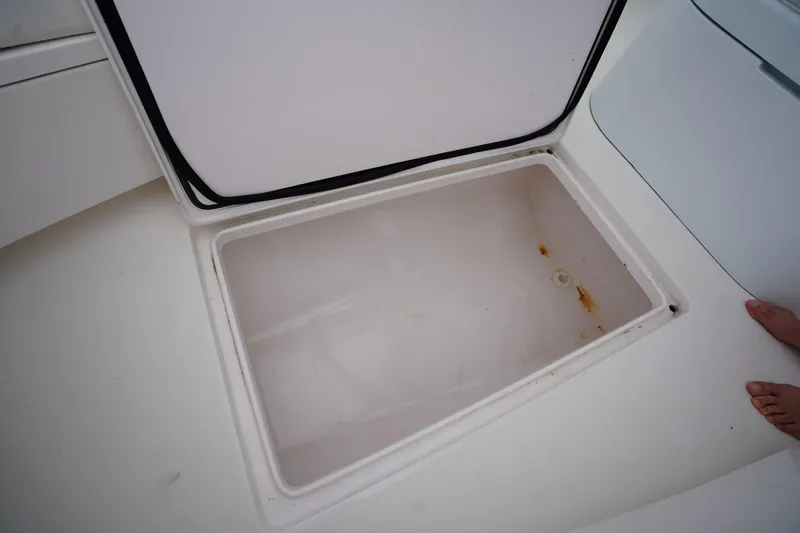 Slide: The Image of Open storage compartment on a 2015 Stuart 26 boat, showing interior details. - 50