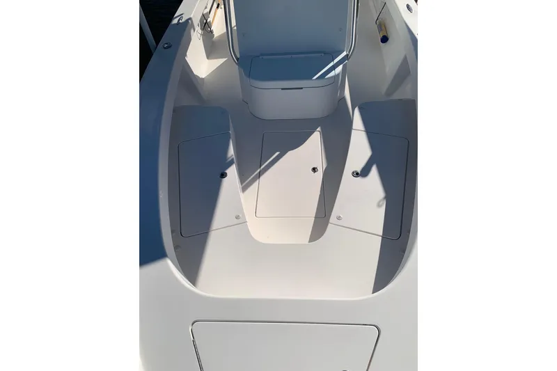 Slide: The Image of Stuart 26 boat deck, 2015 model, featuring storage compartments and seating area. - 12