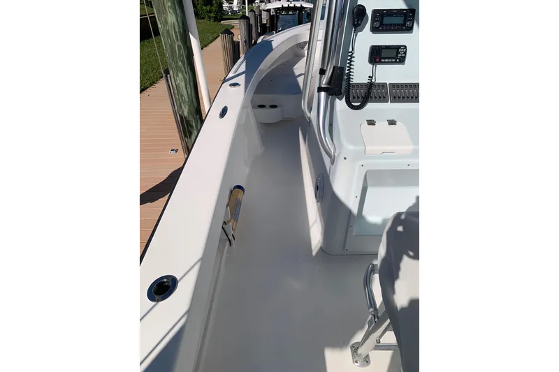 Slide: The Image of 2015 Stuart 26 boat deck with control panel and seating area. - 15