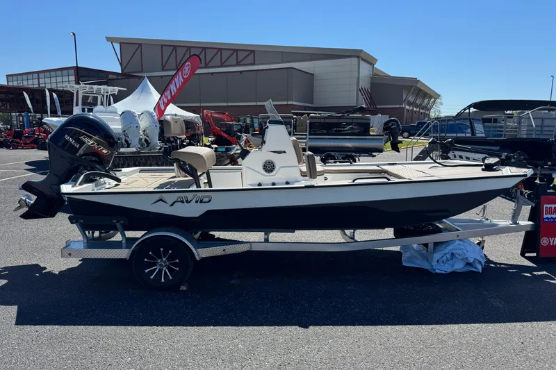 The Image of Avid 207 Recon 2026 boat on trailer at outdoor display event. - 0