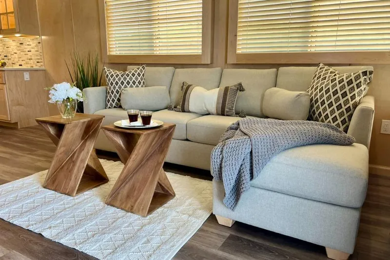 The Image of Modern living room in Sumerset Luxe I 2026, featuring cozy sofa and stylish wooden tables. - 0