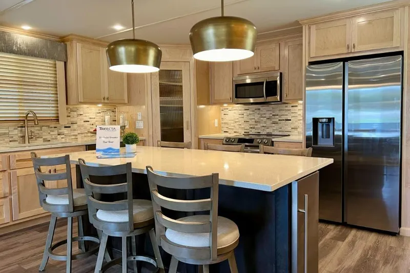 Slide: The Image of Modern kitchen in 2026 Sumerset Luxe I houseboat with island, stainless appliances, and pendant lighting. - 3