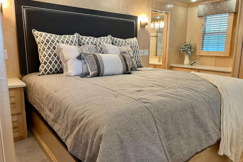 Slide: The Image of Luxurious bedroom in 2026 Sumerset Luxe I houseboat, featuring elegant bedding and modern decor. - 6