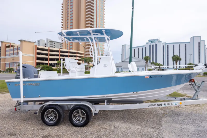 Slide: The Image of 2023 Sportsman Masters 227 Bay Boat on trailer, urban background. - 11
