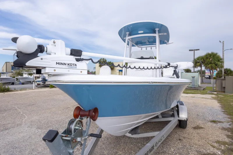 Slide: The Image of 2023 Sportsman Masters 227 Bay Boat with Minn Kota Terrova motor, parked on trailer. - 16