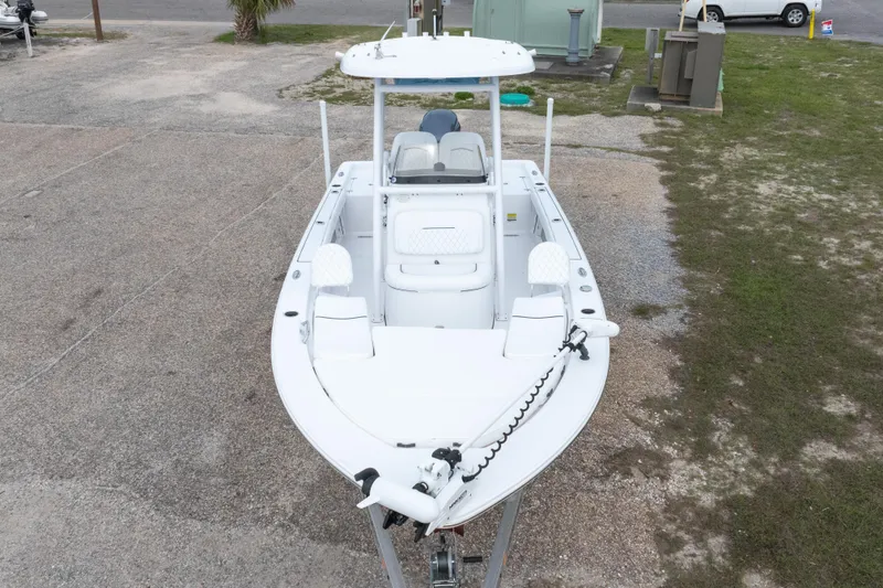 Slide: The Image of 2023 Sportsman Masters 227 Bay Boat, white, parked on gravel, aerial view. - 19