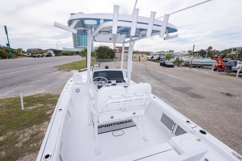Slide: The Image of 2023 Sportsman Masters 227 Bay Boat with center console, parked near a road. - 23