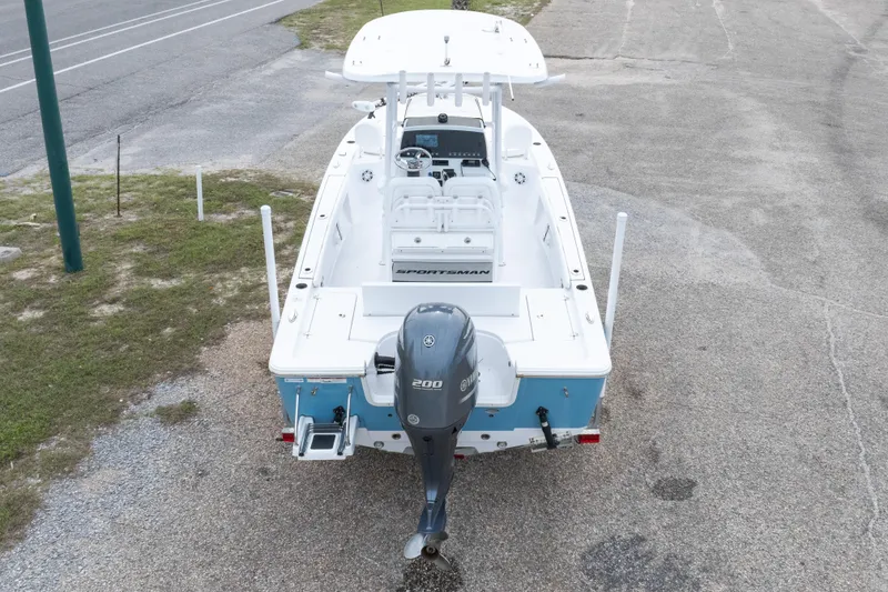 Slide: The Image of 2023 Sportsman Masters 227 Bay Boat with Yamaha outboard motor, parked on pavement. - 27