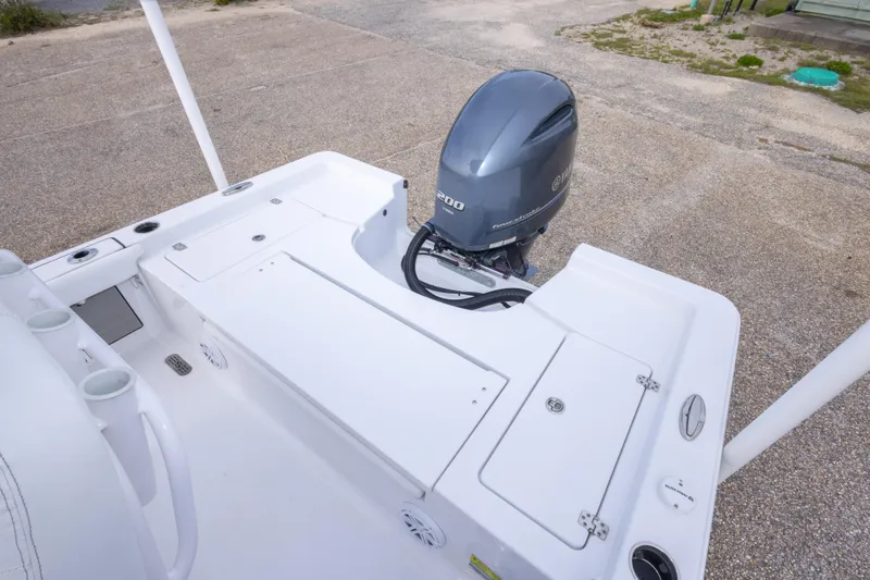 Slide: The Image of 2023 Sportsman Masters 227 Bay Boat with Yamaha outboard motor, showcasing spacious deck layout. - 29