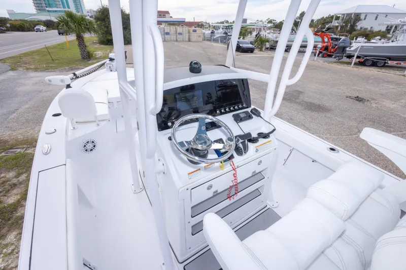 Slide: The Image of 2023 Sportsman Masters 227 Bay Boat cockpit with modern controls and steering wheel. - 30
